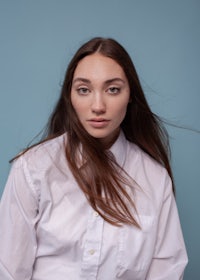 a young woman in a white shirt