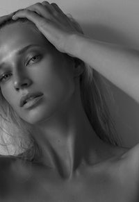 a black and white photo of a naked woman