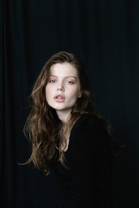 a young woman is posing for a photo